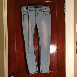 Light skinny jeans with dark embroidery